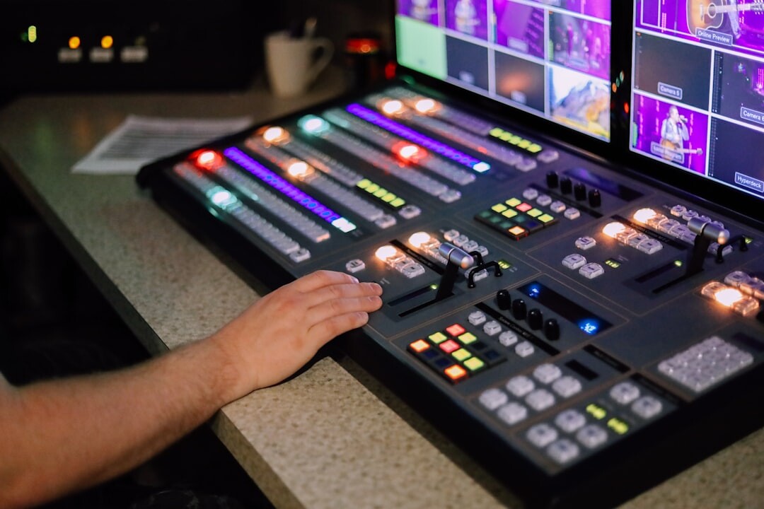 Broadcast control room with multiple video monitors and operators