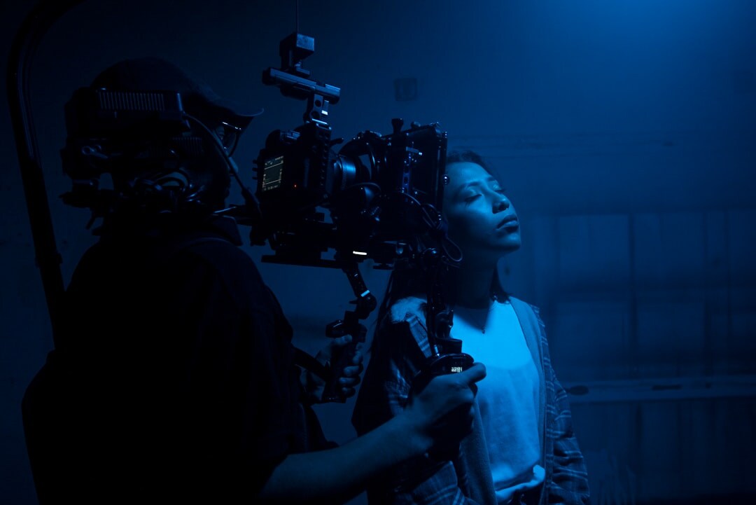 Professional broadcast camera on set with operator